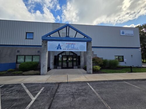 Entrance of the Air Innovations headquarters with a banner reading "Celebrating 40 Years of Air Innovations"